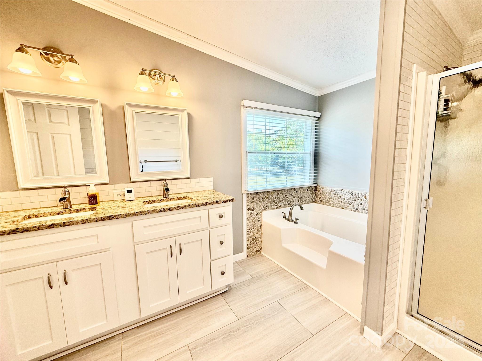 37 Suede Lane Ridgeway, SC 29130 - Photo 22 of 42 a spacious bathroom with a sink double vanity and a mirror
