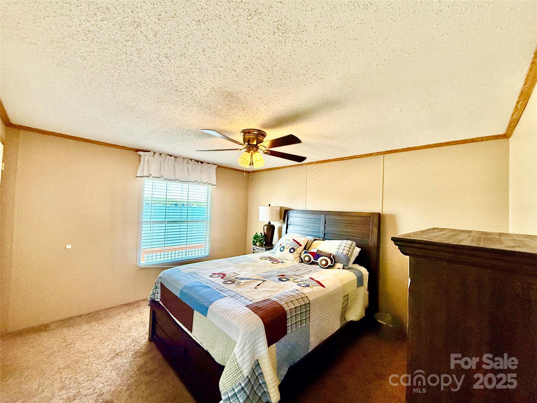 37 Suede Lane Ridgeway, SC 29130 - Photo 24 of 42 a bedroom with a bed and a window