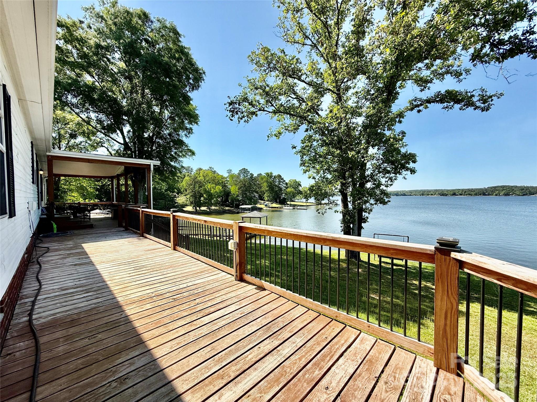 37 Suede Lane Ridgeway, SC 29130 - Photo 31 of 42 a view of deck with wooden floor and fence next to a yard