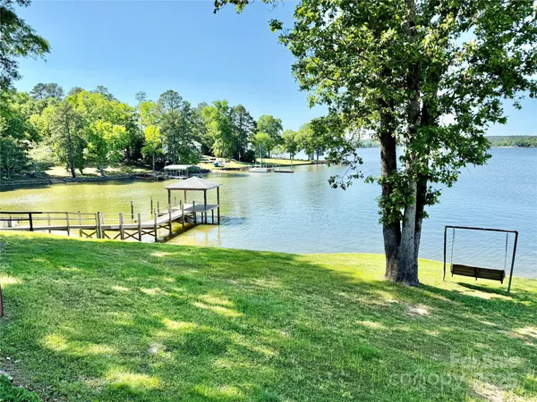 a view of swimming pool with a yard and seating space