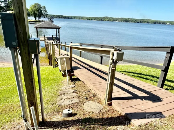 a view of a backyard with a lake view