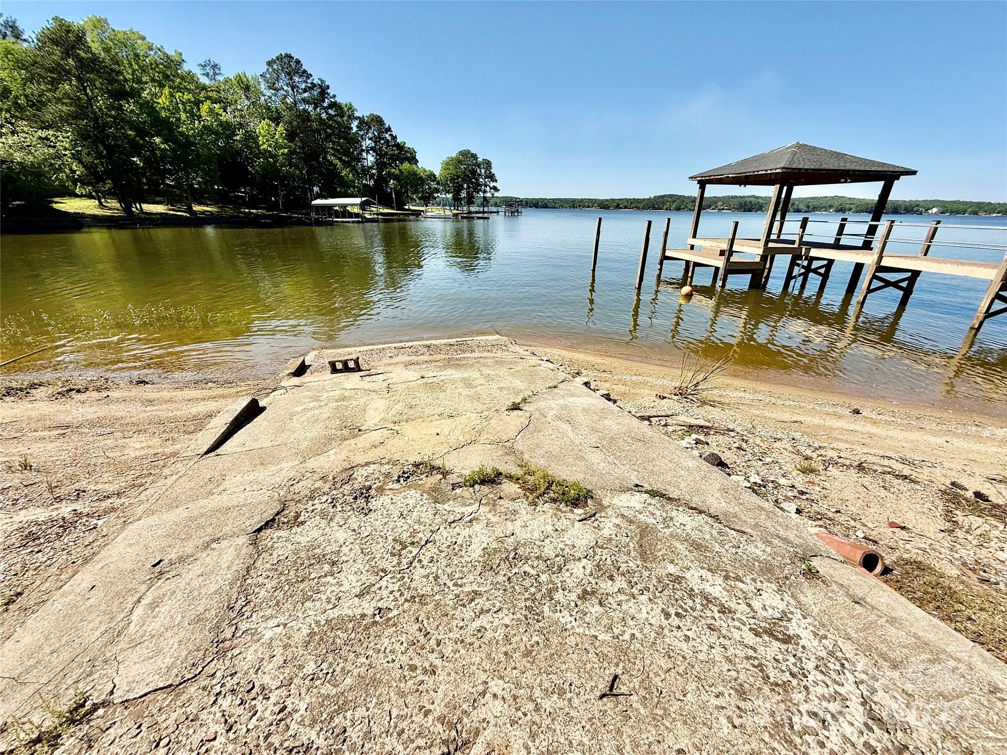 37 Suede Lane Ridgeway, SC 29130 - Photo 39 of 42 a view of a lake with a table and chairs