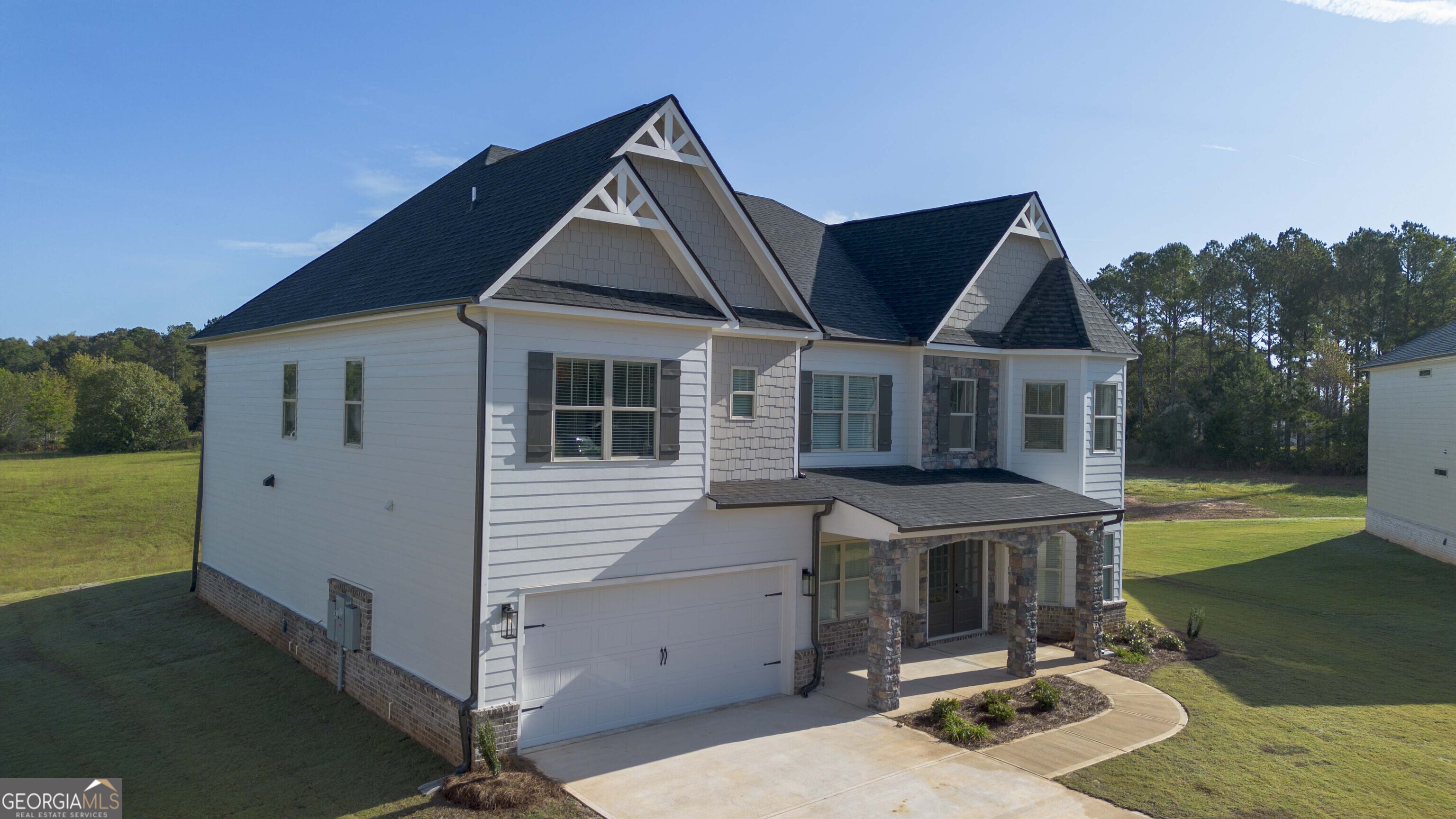 600 Beaver Court Perry, GA 31069 - Photo 3 of 48 a front view of house with yard outdoor seating and barbeque oven