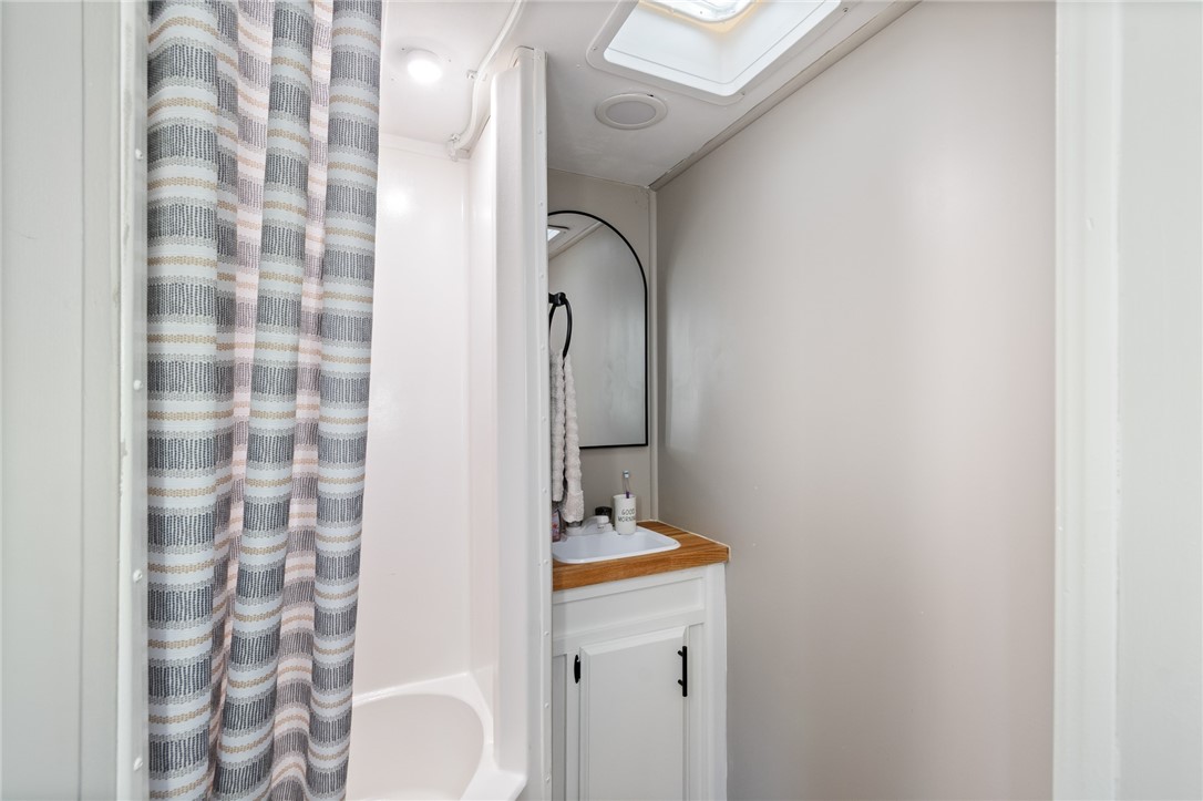 7945 Lake Road, Unit 129 Sodus, NY 14555 - Photo 17 of 22 The bathroom- even has a mini soaking tub!