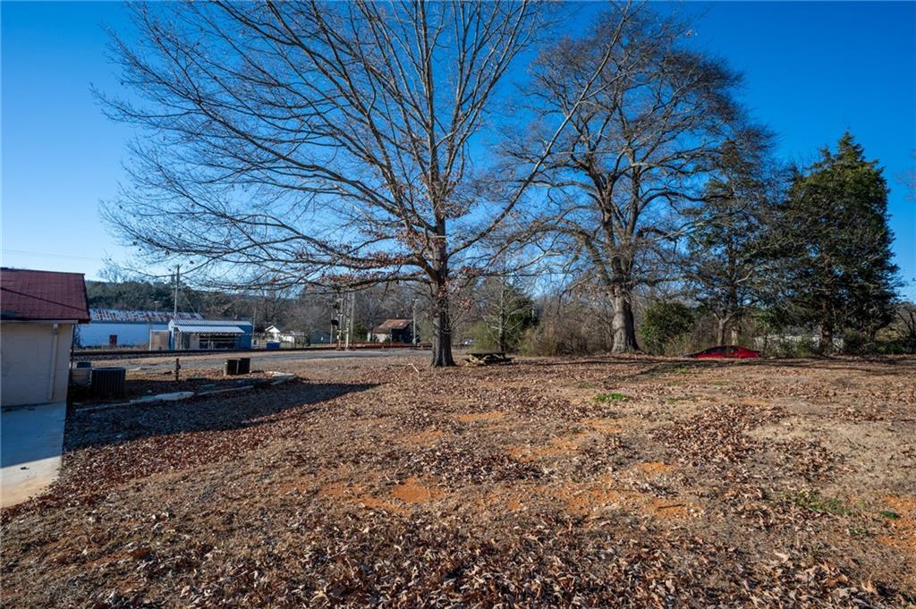 3035 Sugar Valley Road Northwest Sugar Valley, GA 30746 - Photo 18 of 18 a view of a yard with a house