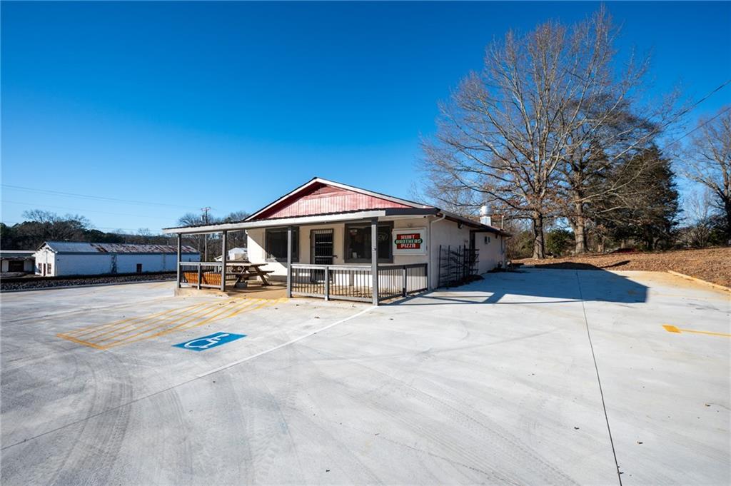 3035 Sugar Valley Road Northwest Sugar Valley, GA 30746 - Photo 3 of 18 a front view of a house with yard