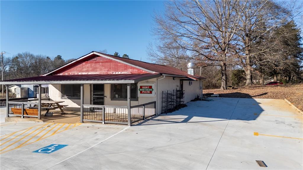 3035 Sugar Valley Road Northwest Sugar Valley, GA 30746 - Photo 4 of 18 a front view of a house with sitting area