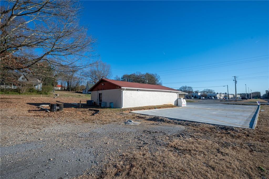 3035 Sugar Valley Road Northwest Sugar Valley, GA 30746 - Photo 5 of 18 a view of a house with a yard