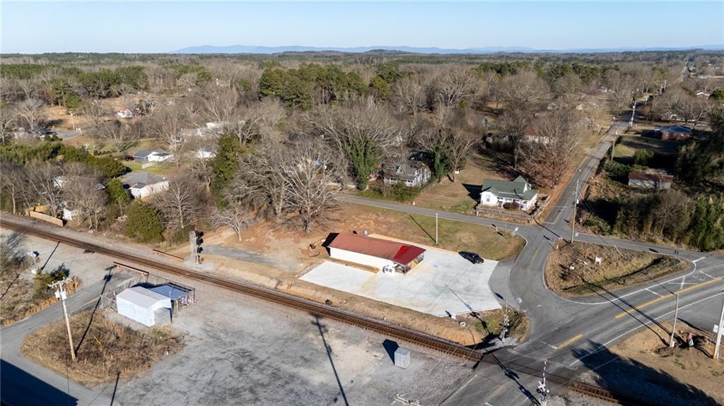 3035 Sugar Valley Road Northwest Sugar Valley, GA 30746 - Photo 8 of 18 an aerial view of a house with yard