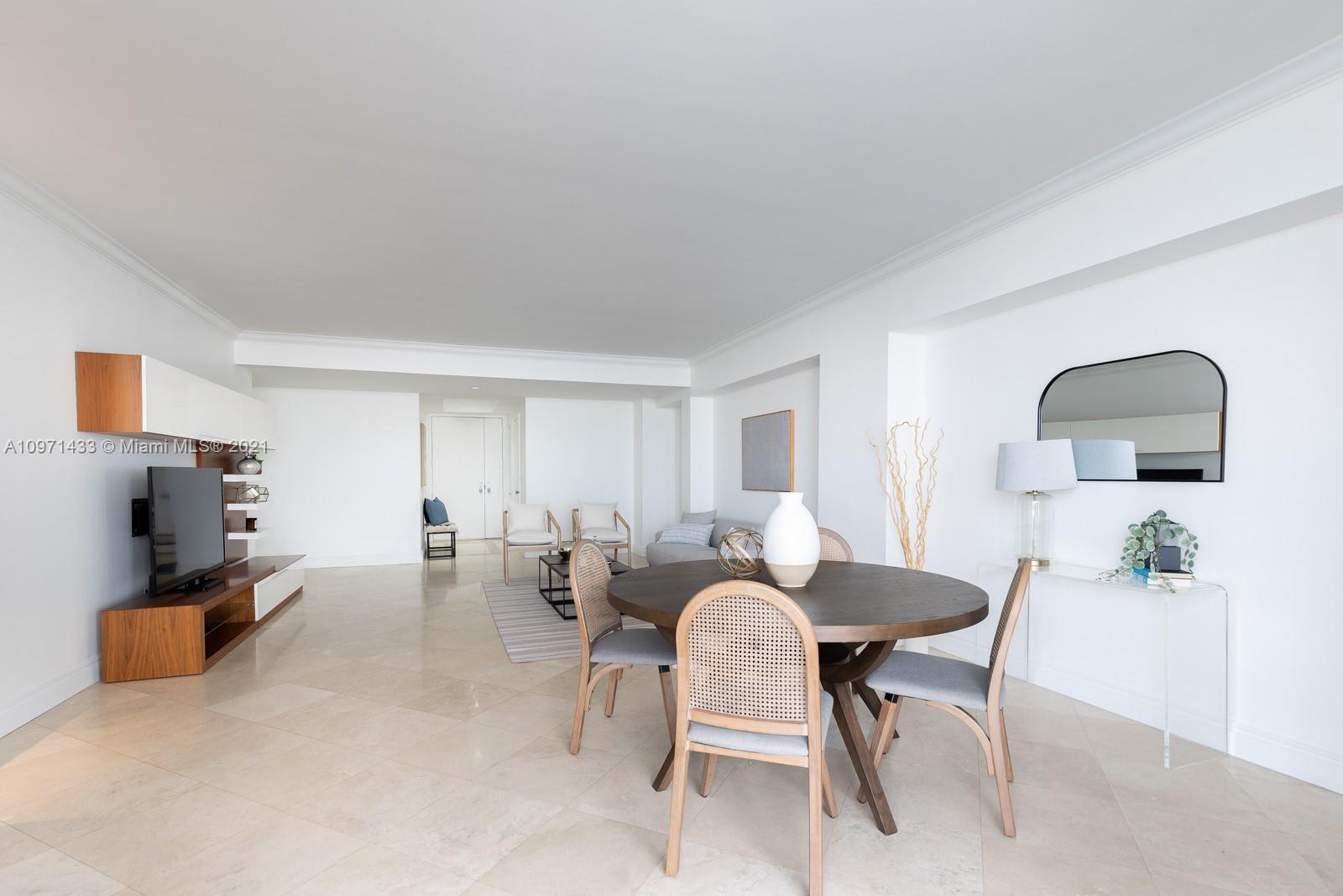 848 Brickell Key Drive, Unit 904 Miami, FL 33131 - Photo 9 of 31 a living room with furniture