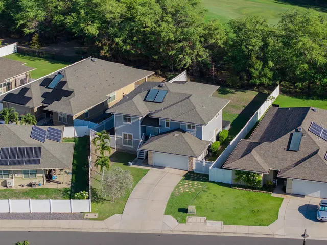 an aerial view of a house with a garden