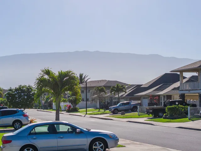 a view of a cars park in front of house