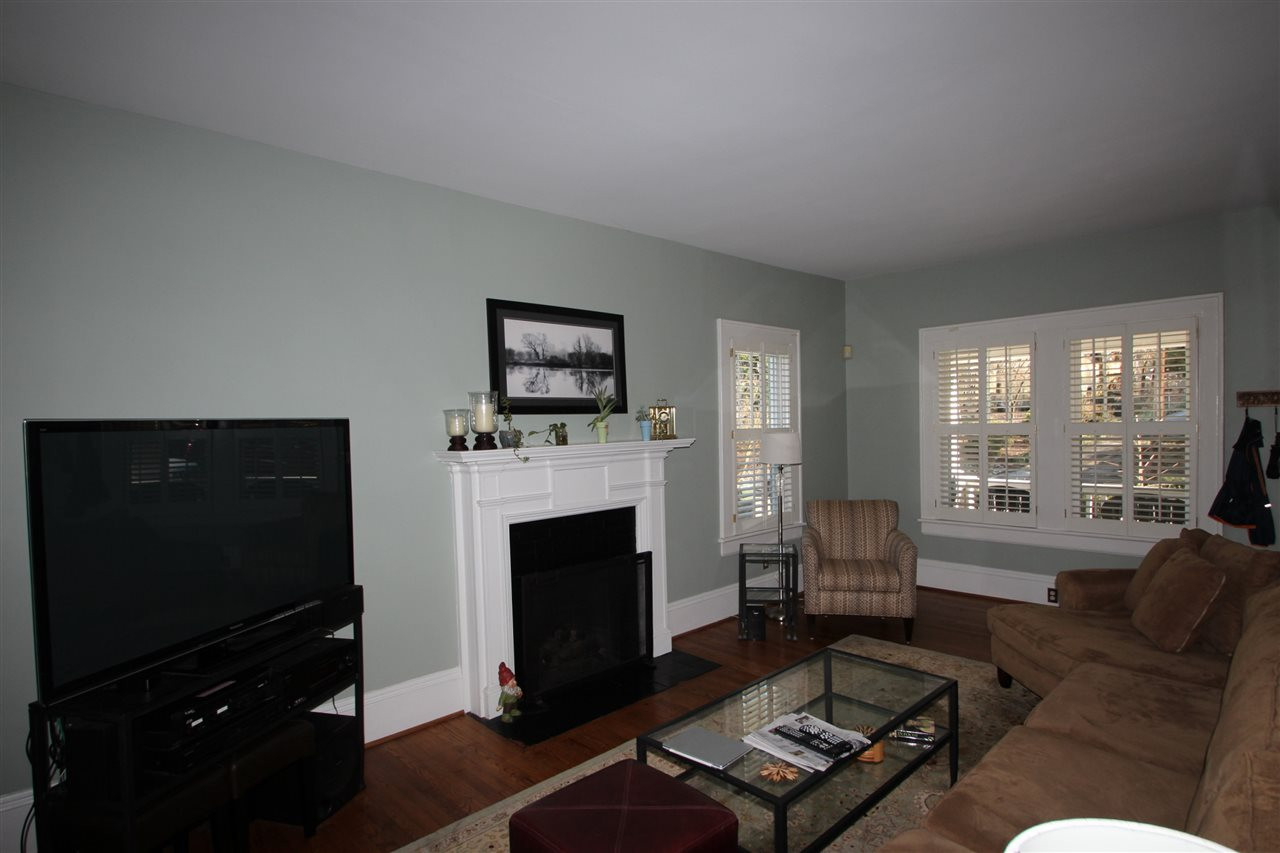 1827 White Oak Road Raleigh, NC 27608 - Photo 3 of 25 Living room with fireplace and hardwood floors Living Room