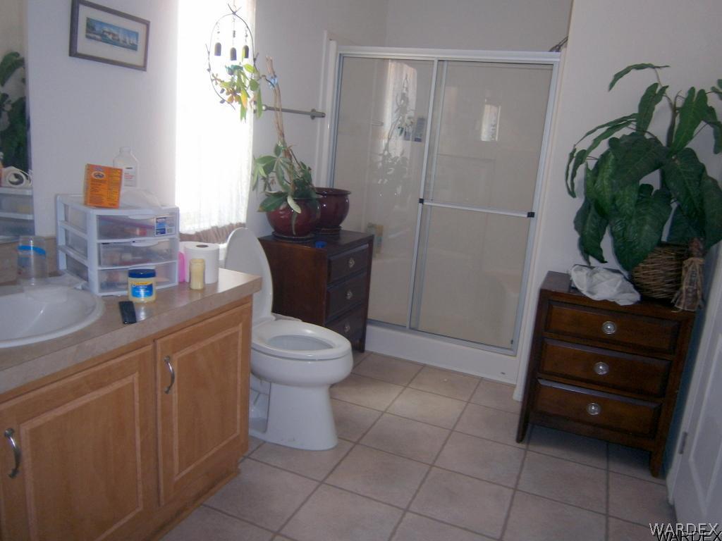 13411 South Water Reed Way, Unit 3 Topock, AZ 86436 - Photo 11 of 16 a bathroom with a toilet and a sink