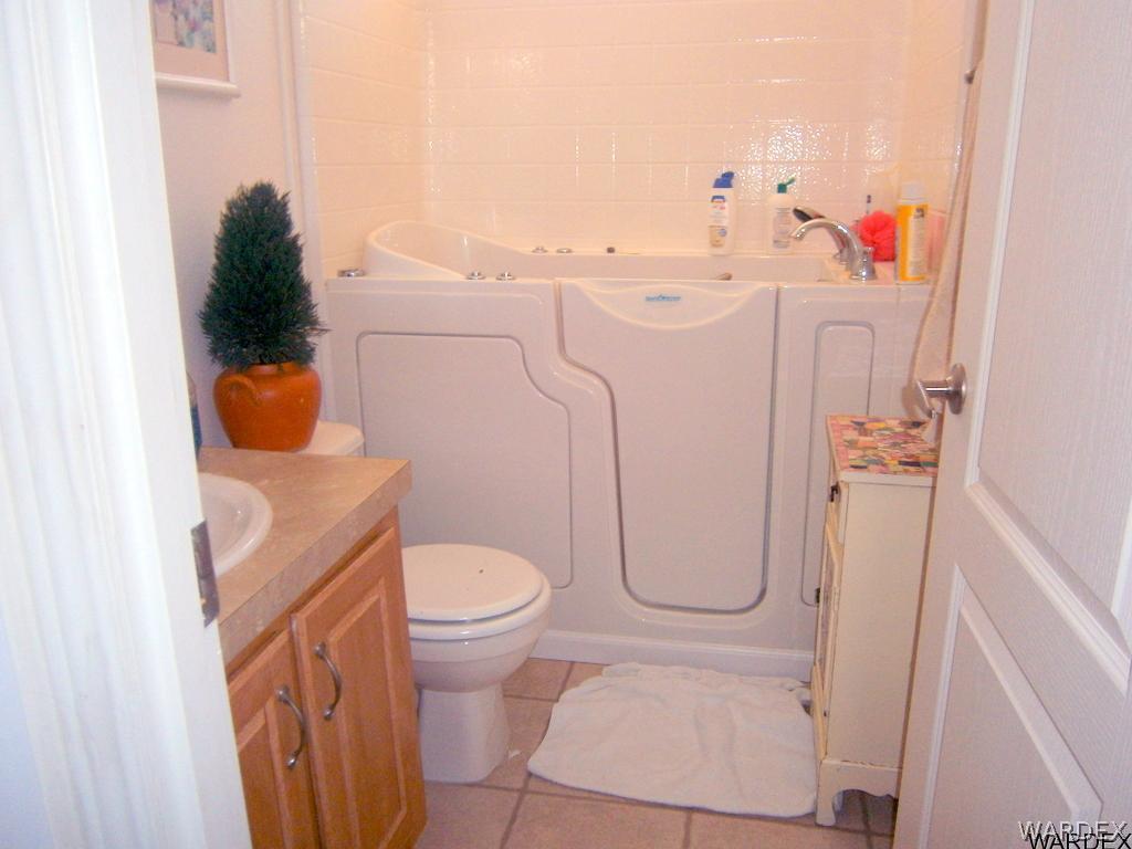 13411 South Water Reed Way, Unit 3 Topock, AZ 86436 - Photo 12 of 16 a bathroom with a toilet and shower curtain