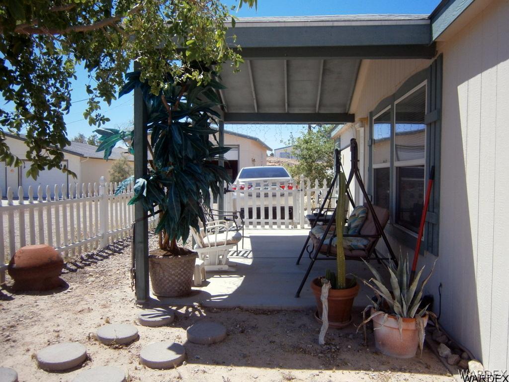 13411 South Water Reed Way, Unit 3 Topock, AZ 86436 - Photo 15 of 16 a view of a porch with furniture and floor to ceiling window