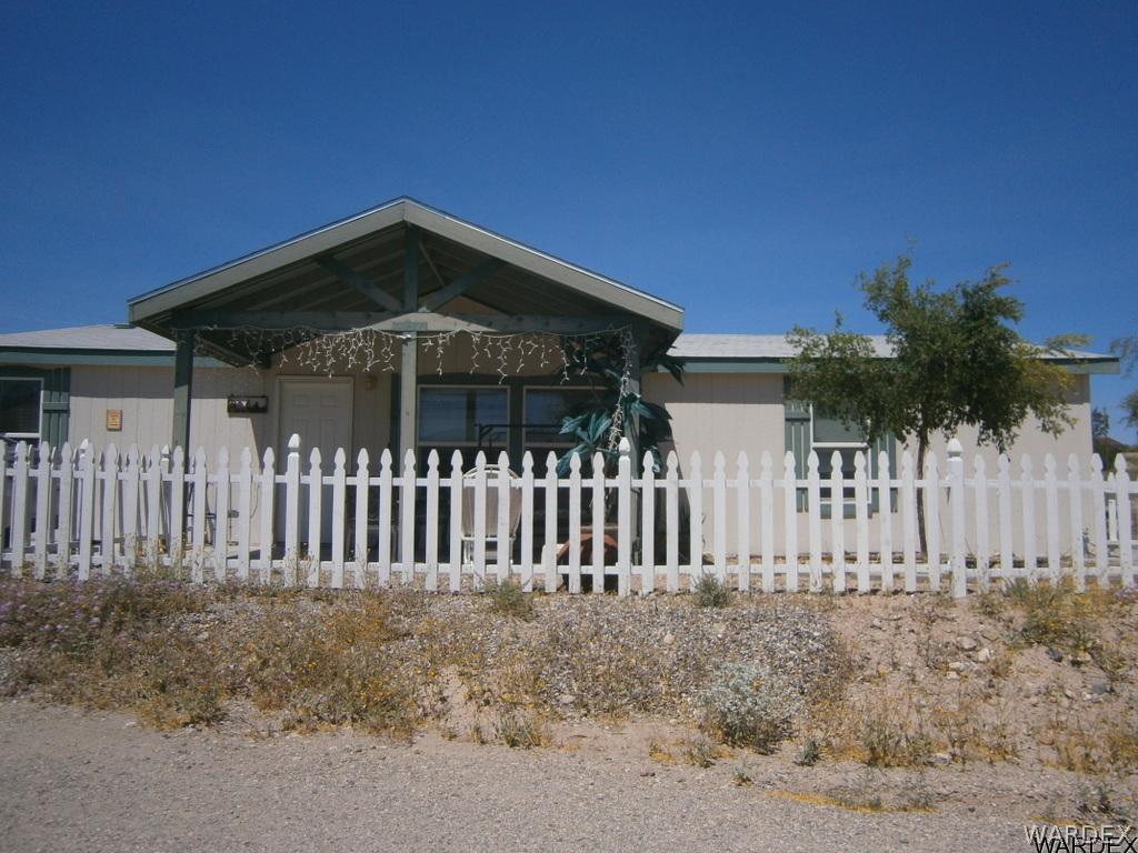 13411 South Water Reed Way, Unit 3 Topock, AZ 86436 - Photo 2 of 16 a front view of a house with iron fence
