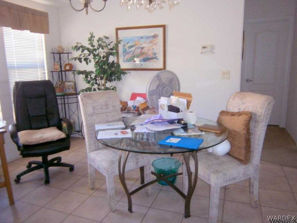 13411 South Water Reed Way, Unit 3 Topock, AZ 86436 - Photo 7 of 16 a living room with furniture and a mirror
