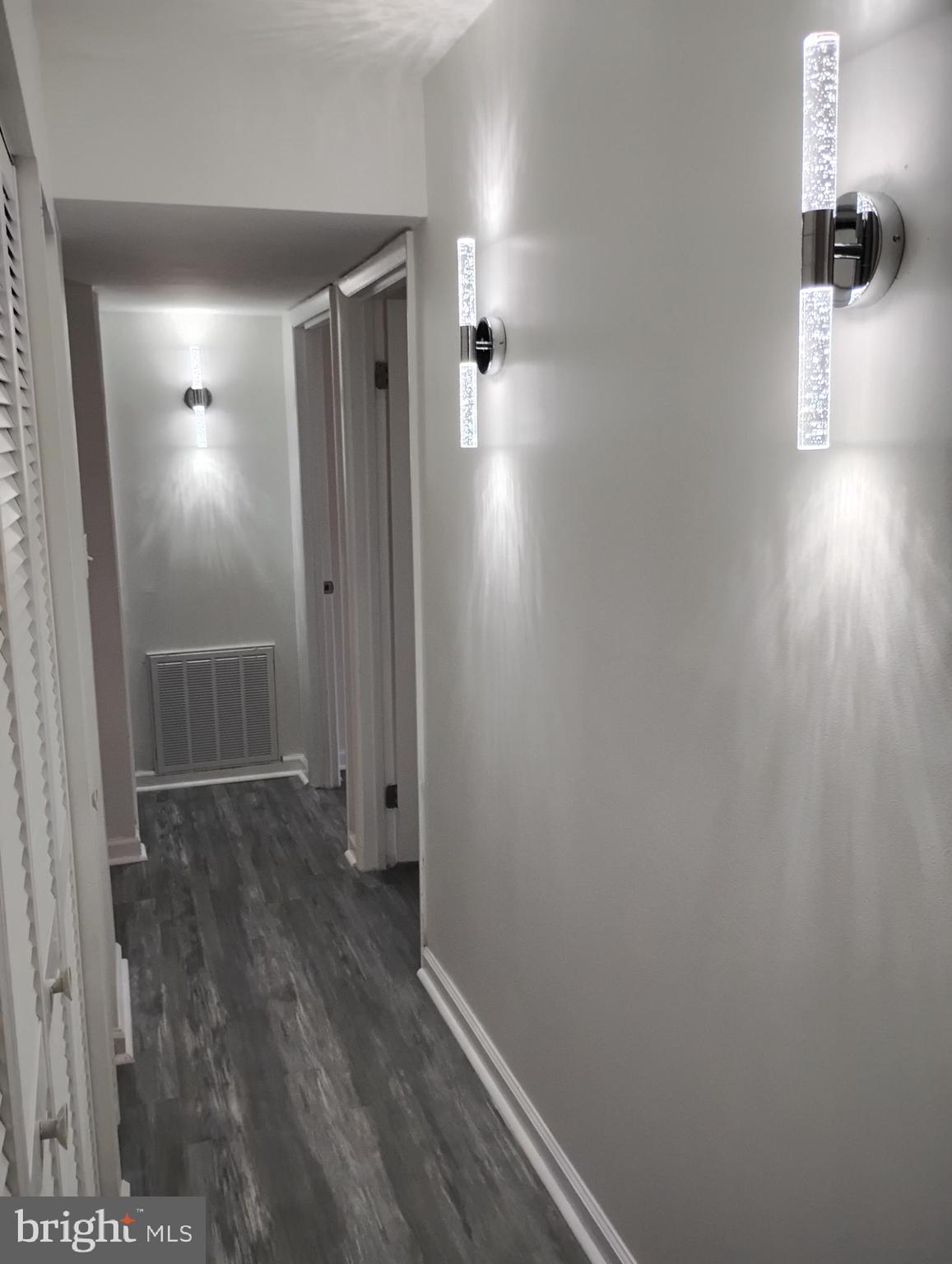 8435 Greenbelt Road, Unit 202 Greenbelt, MD 20770 - Photo 12 of 20 a view of a hallway with wooden floor