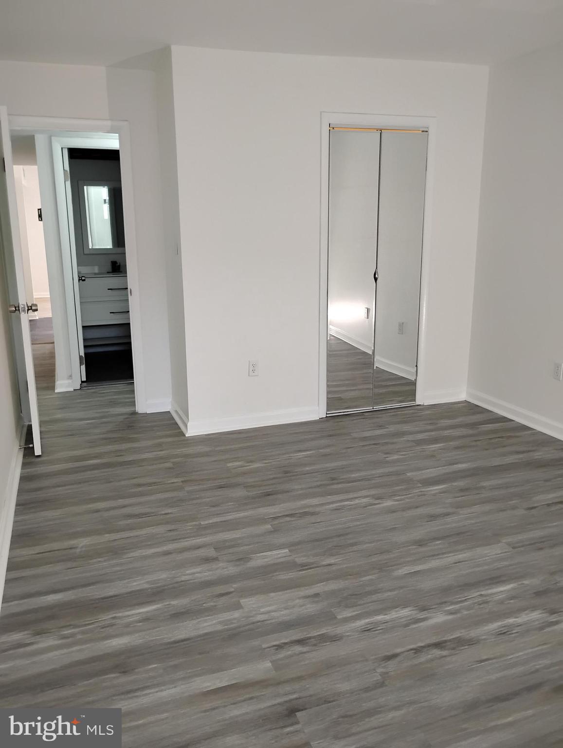8435 Greenbelt Road, Unit 202 Greenbelt, MD 20770 - Photo 16 of 20 a view of a room with wooden floor