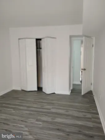 a view of a park with bench and trees