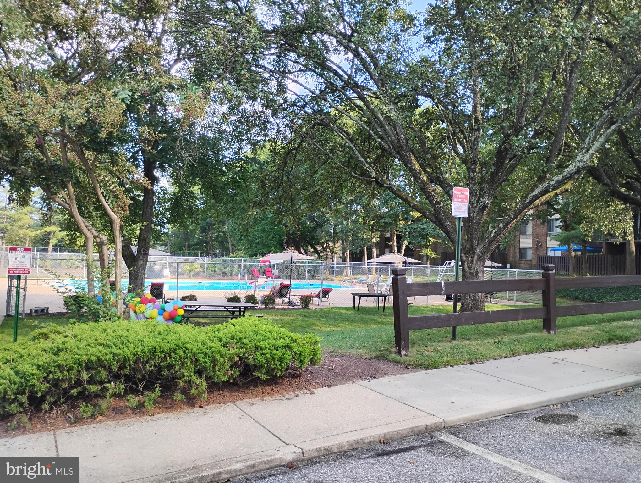 8435 Greenbelt Road, Unit 202 Greenbelt, MD 20770 - Photo 20 of 20 a view of a park with bench and trees