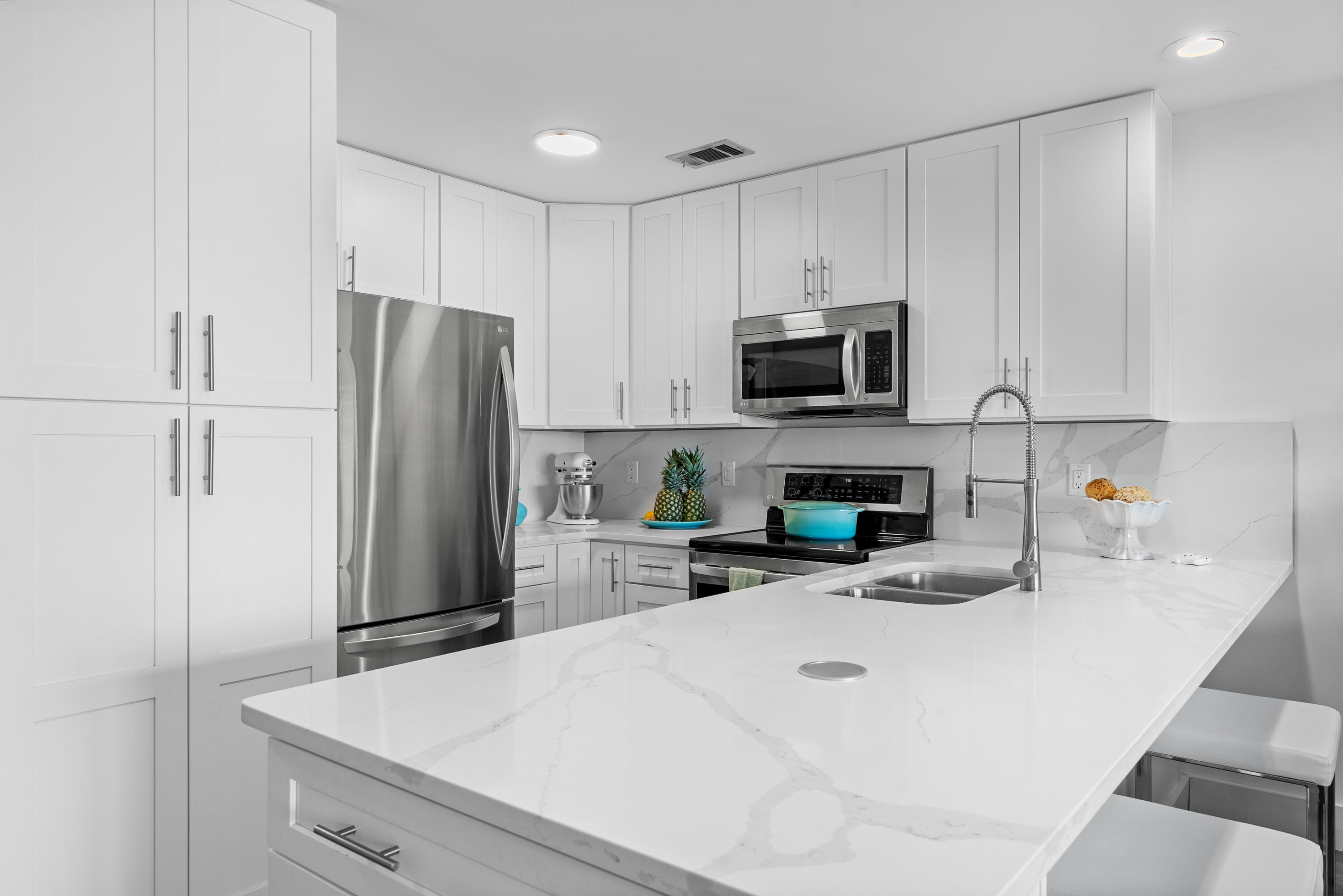 48 Stewart Lake Cove, Unit 194 Miramar Beach, FL 32550 - Photo 11 of 57 a kitchen with stainless steel appliances a refrigerator sink and microwave