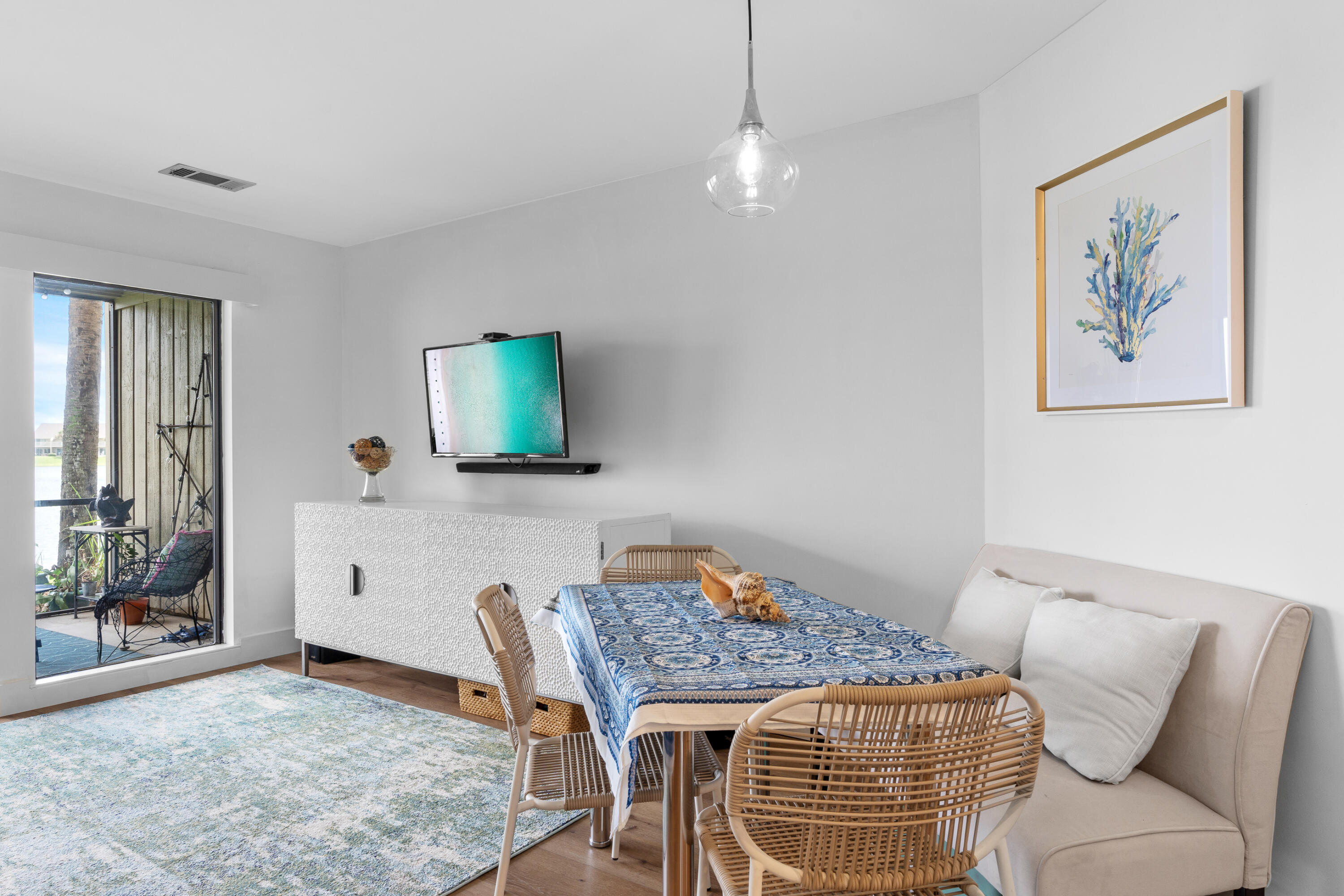 48 Stewart Lake Cove, Unit 194 Miramar Beach, FL 32550 - Photo 18 of 57 a living room with furniture a flat screen tv and a table