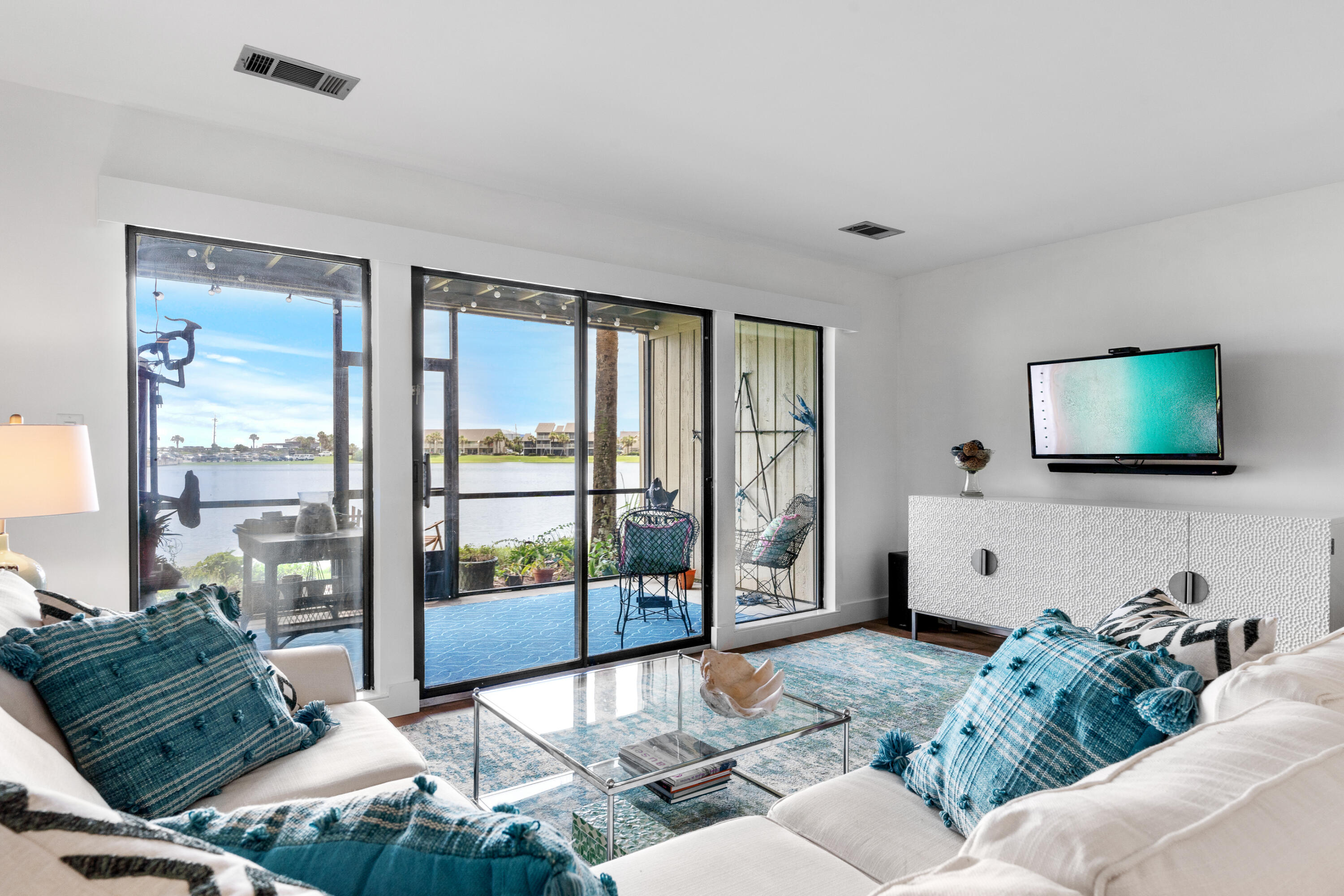 48 Stewart Lake Cove, Unit 194 Miramar Beach, FL 32550 - Photo 21 of 57 a living room with furniture and a flat screen tv
