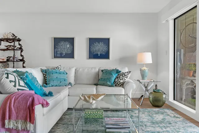 a living room with furniture and a table