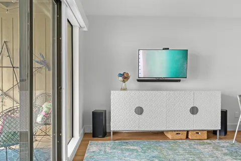 a bedroom with a bed and a mirror