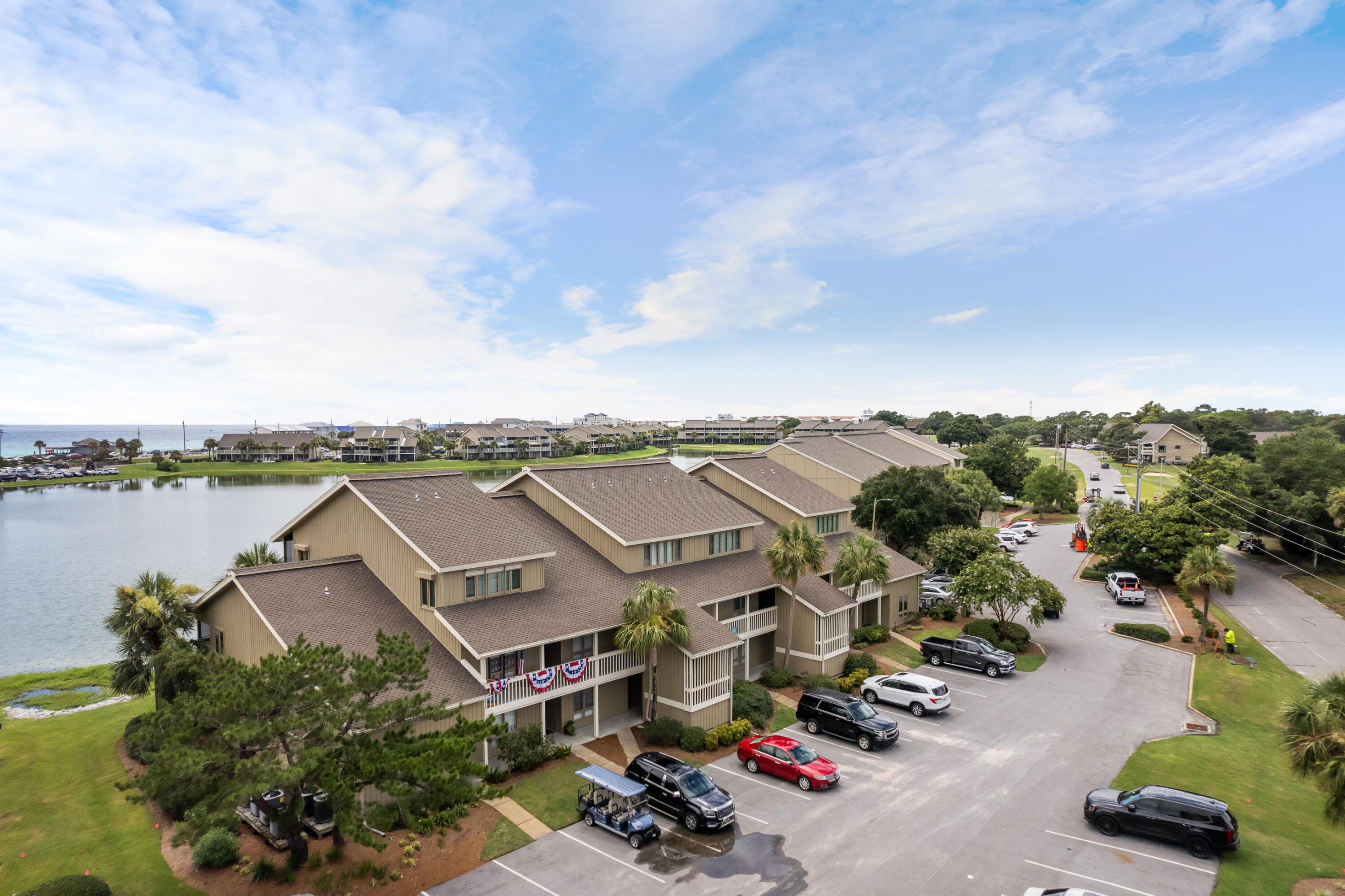 48 Stewart Lake Cove, Unit 194 Miramar Beach, FL 32550 - Photo 3 of 57 an aerial view of a house with a garden space and lake view