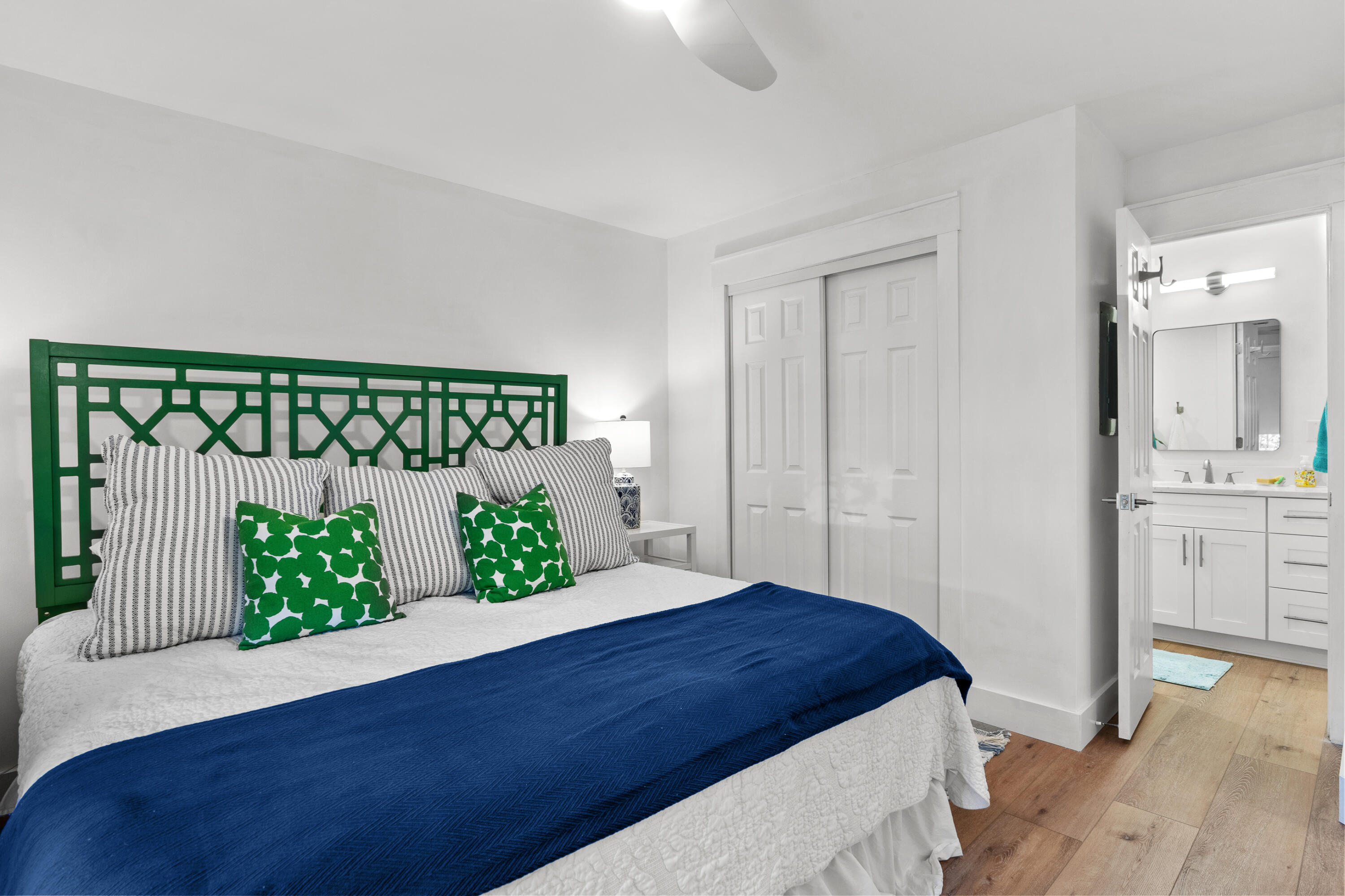 48 Stewart Lake Cove, Unit 194 Miramar Beach, FL 32550 - Photo 33 of 57 a bedroom with a bed and a mirror