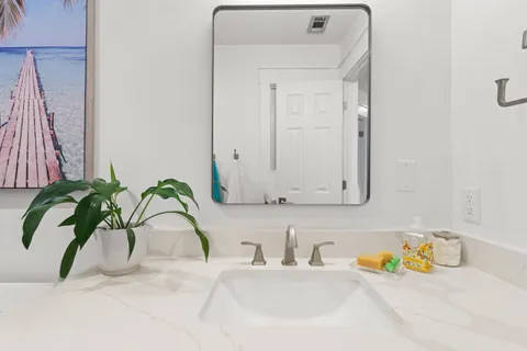 a view of a porch with a table and chairs