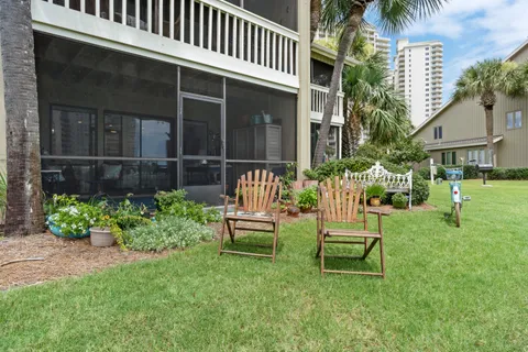 an aerial view of a houses with swimming pool and outdoor space