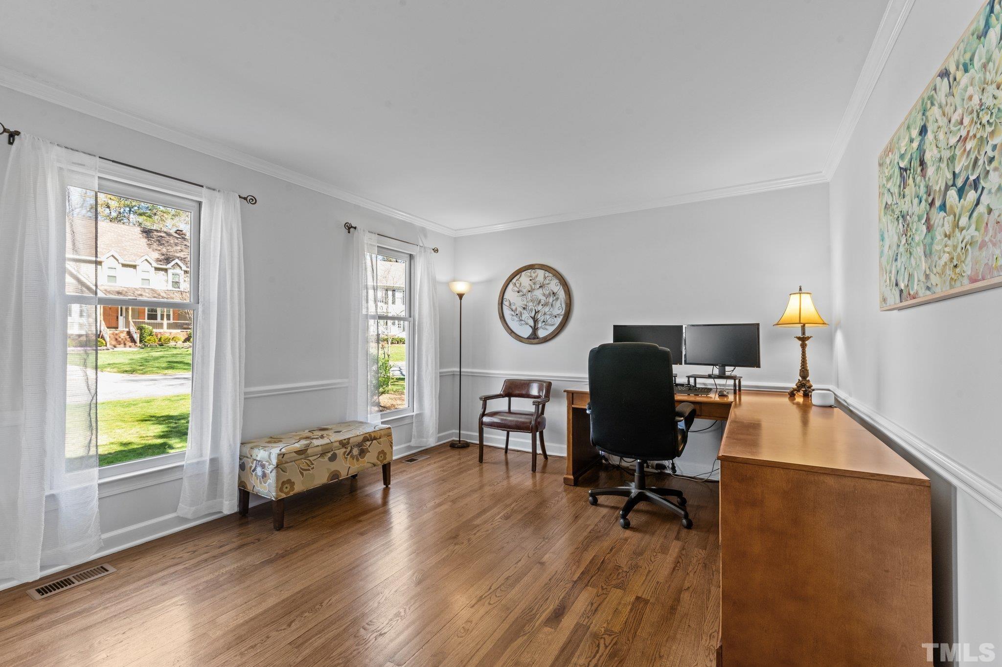 8325 Apple Orchard Way Raleigh, NC 27615 - Photo 11 of 54 a view of a livingroom with workspace and a window