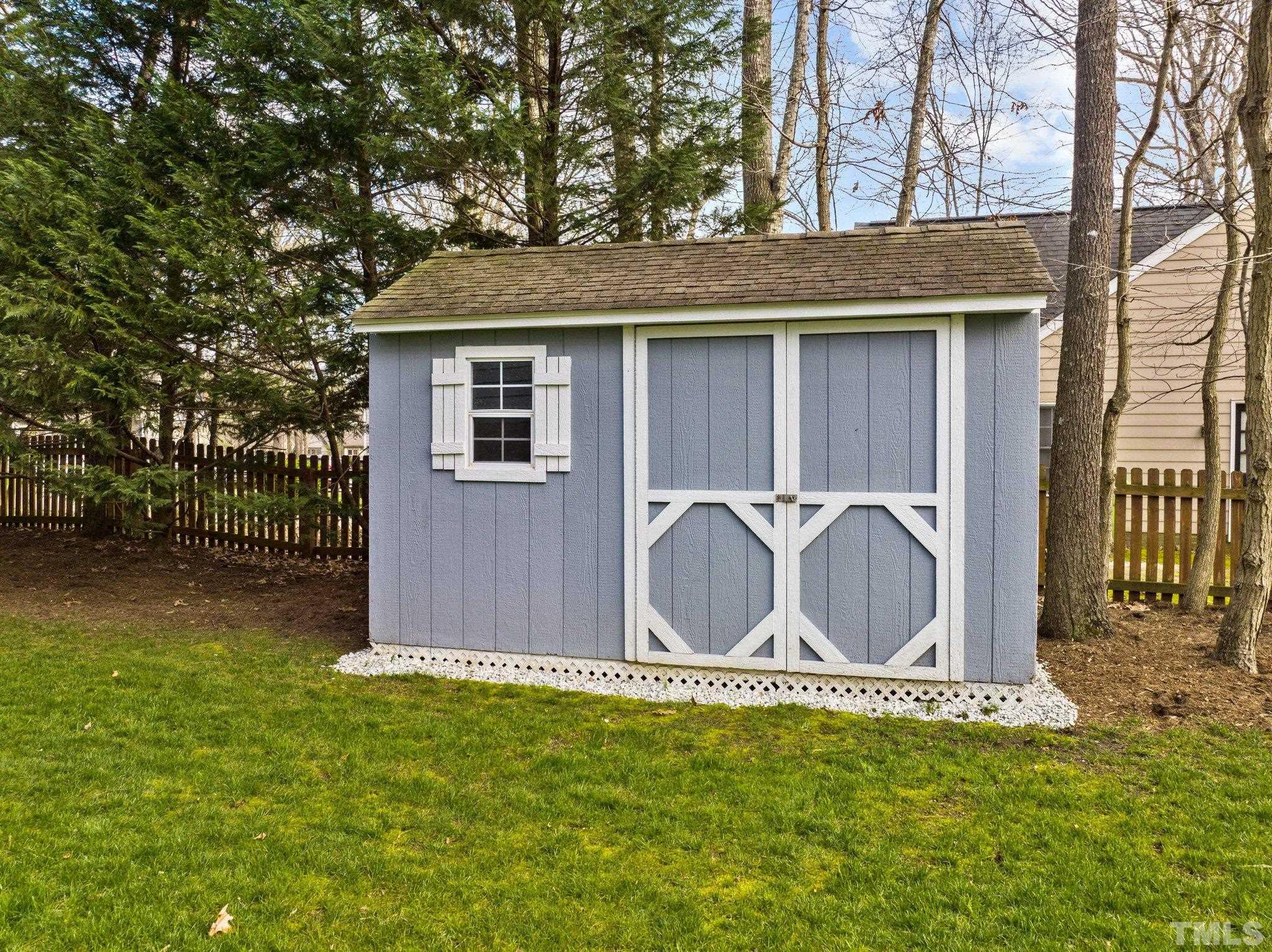 8325 Apple Orchard Way Raleigh, NC 27615 - Photo 39 of 54 a front view of a house with garden