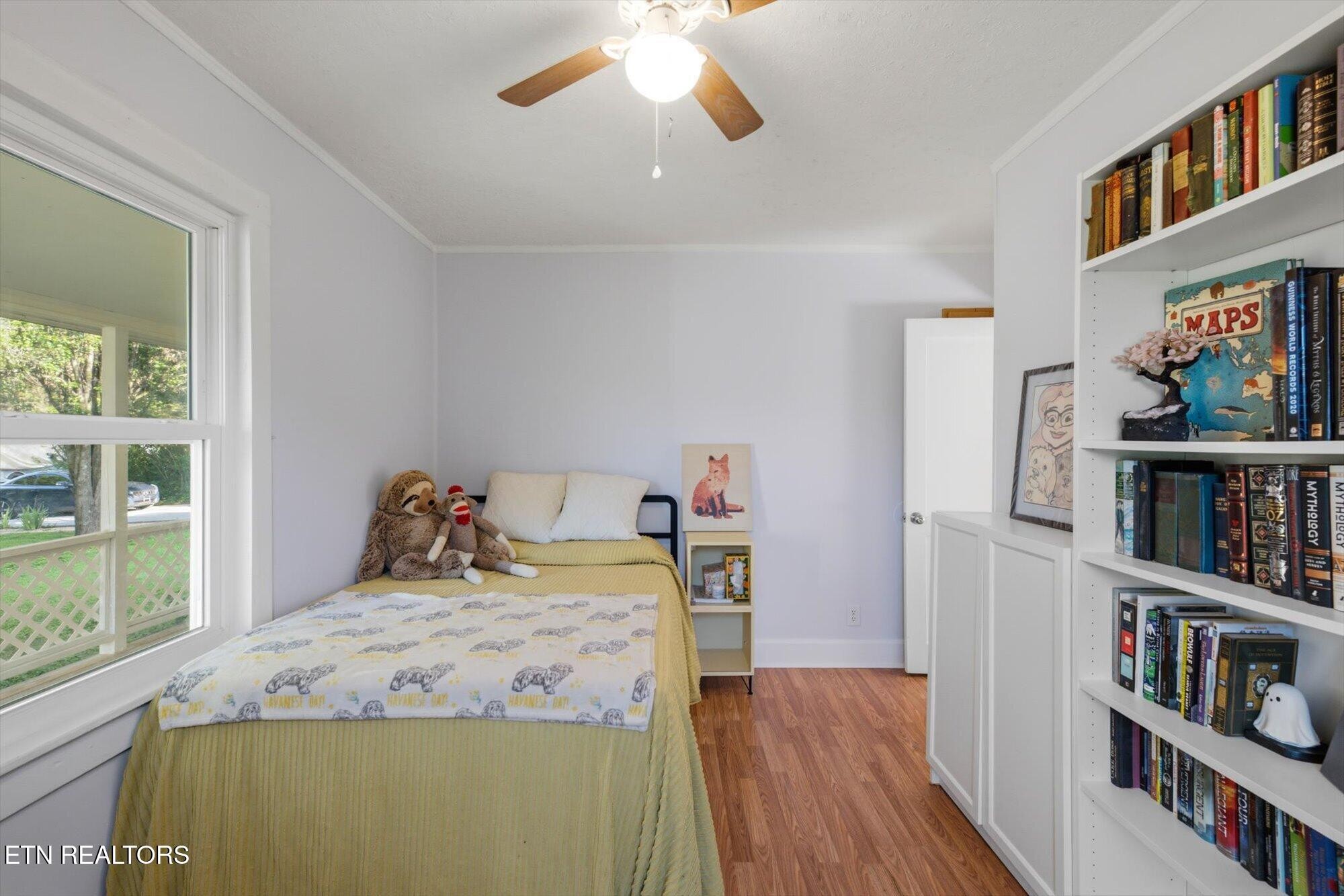159 Mill Street Delano, TN 37325 - Photo 16 of 22 a bed room with a bed and a book shelf