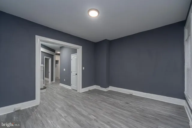 a view of hallway with wooden floor