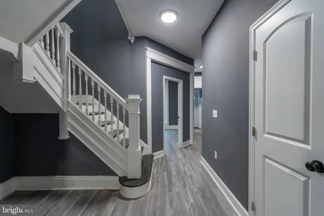 a view of an entryway with wooden floor