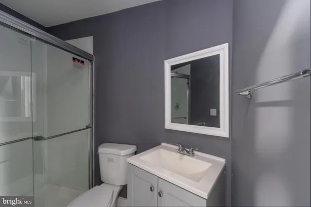 a bathroom with a sink toilet and vanity