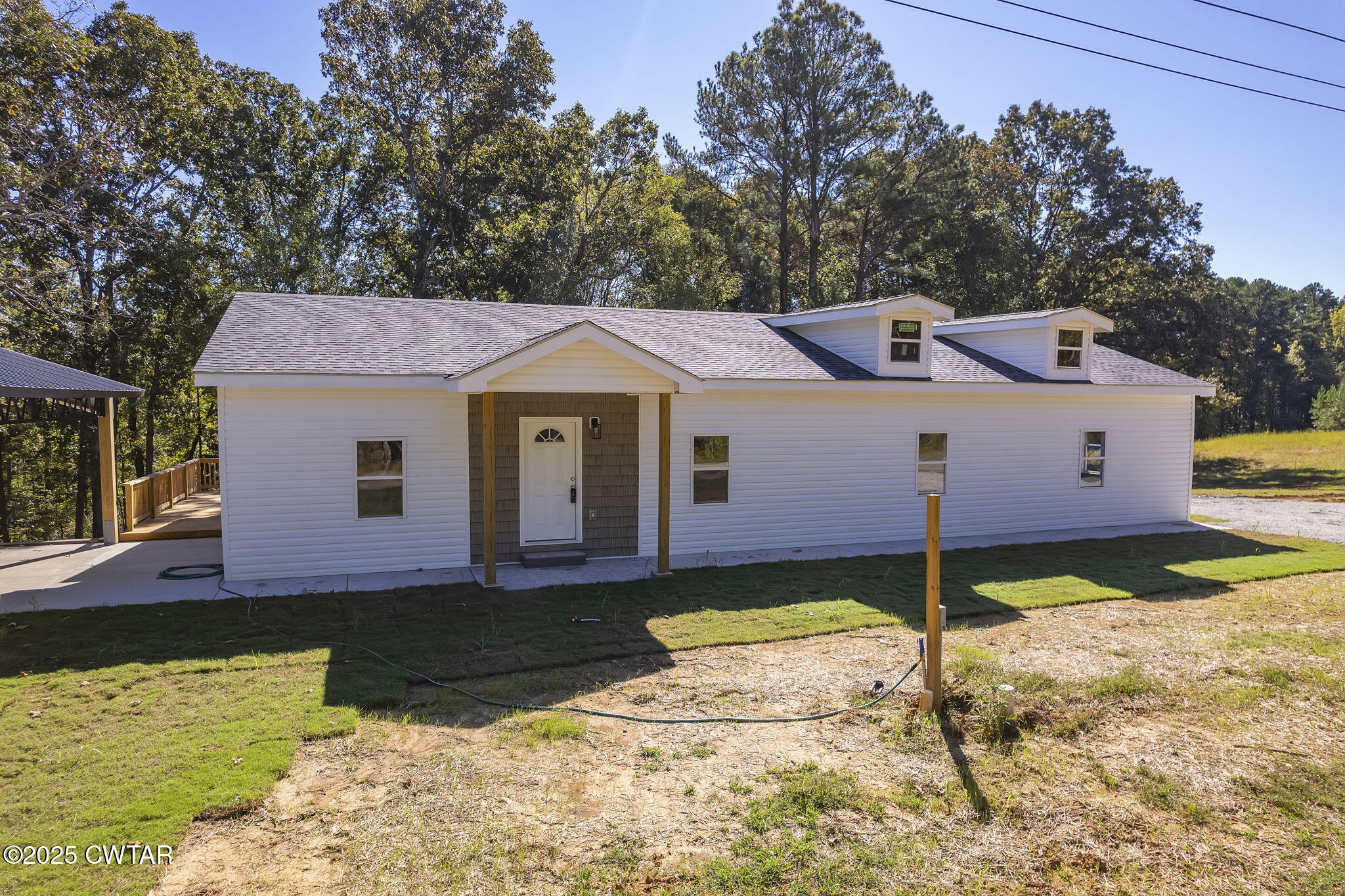 2885 Old Friendship Road Finger, TN 38334 - Photo 24 of 50 a front view of a house with a yard