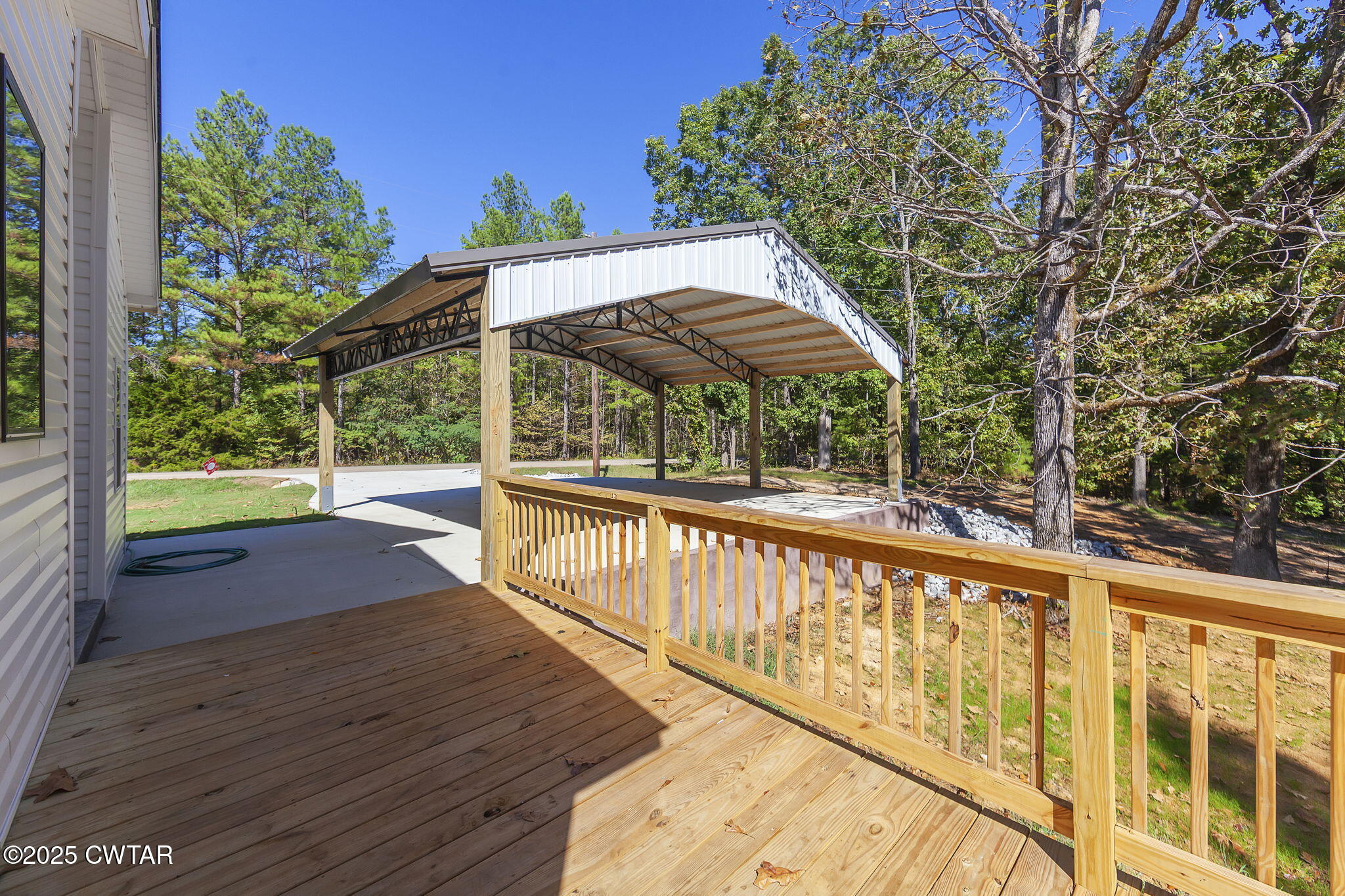 2885 Old Friendship Road Finger, TN 38334 - Photo 32 of 50 a view of a patio with wooden floor next to a yard
