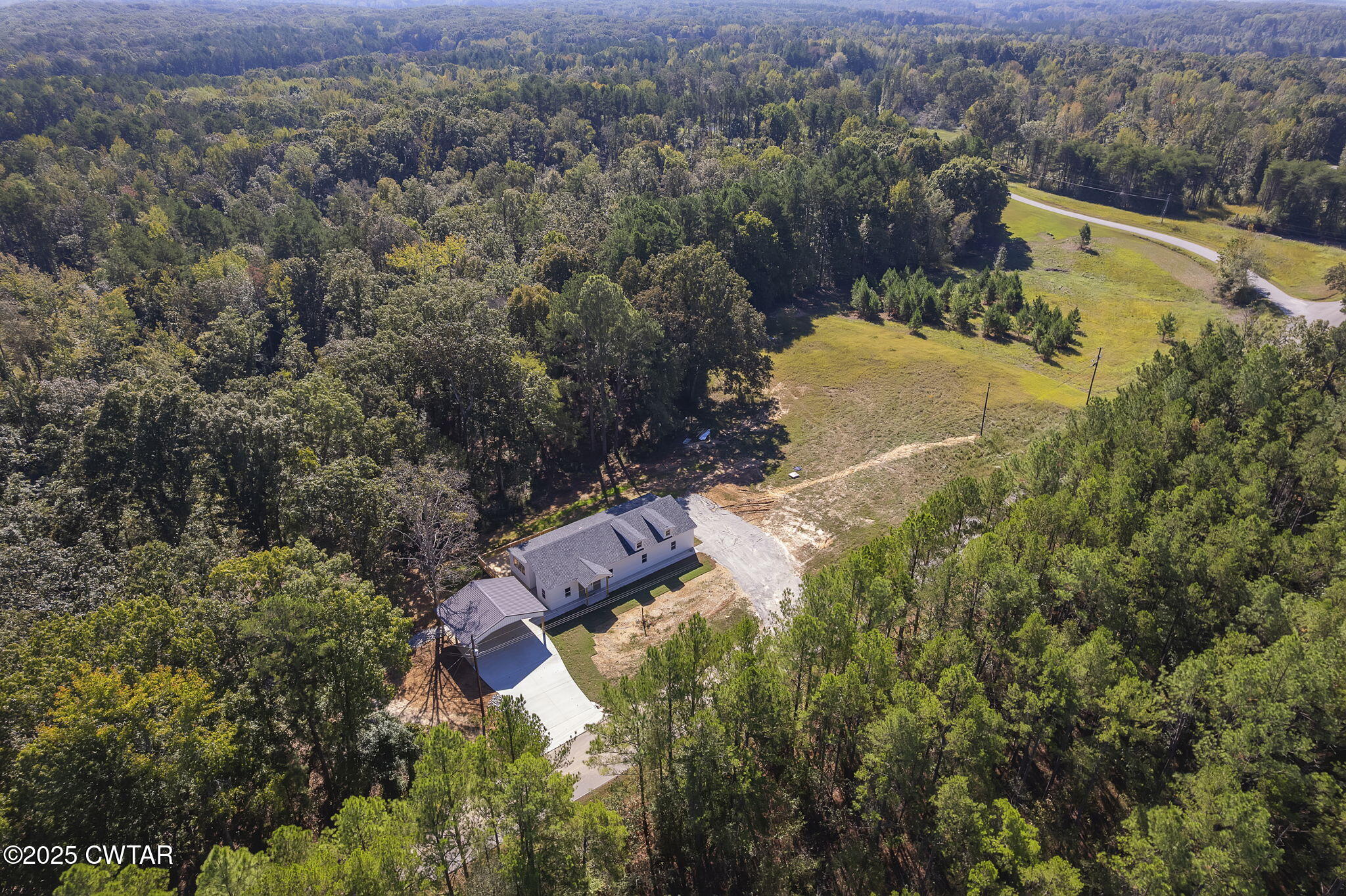 2885 Old Friendship Road Finger, TN 38334 - Photo 36 of 50 an aerial view of residential house with outdoor space and trees all around