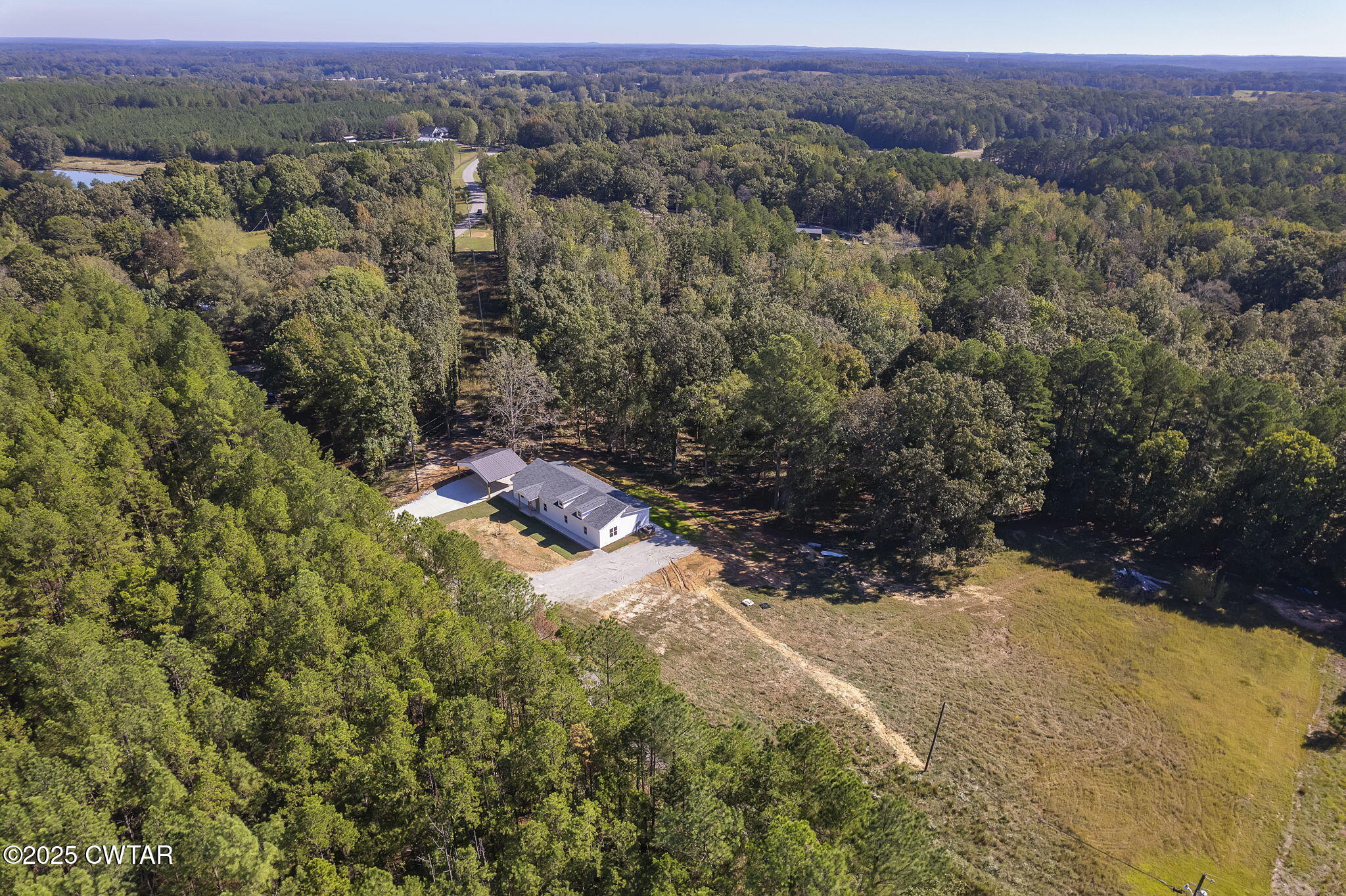 2885 Old Friendship Road Finger, TN 38334 - Photo 37 of 50 an aerial view of houses with yard and mountain view in back