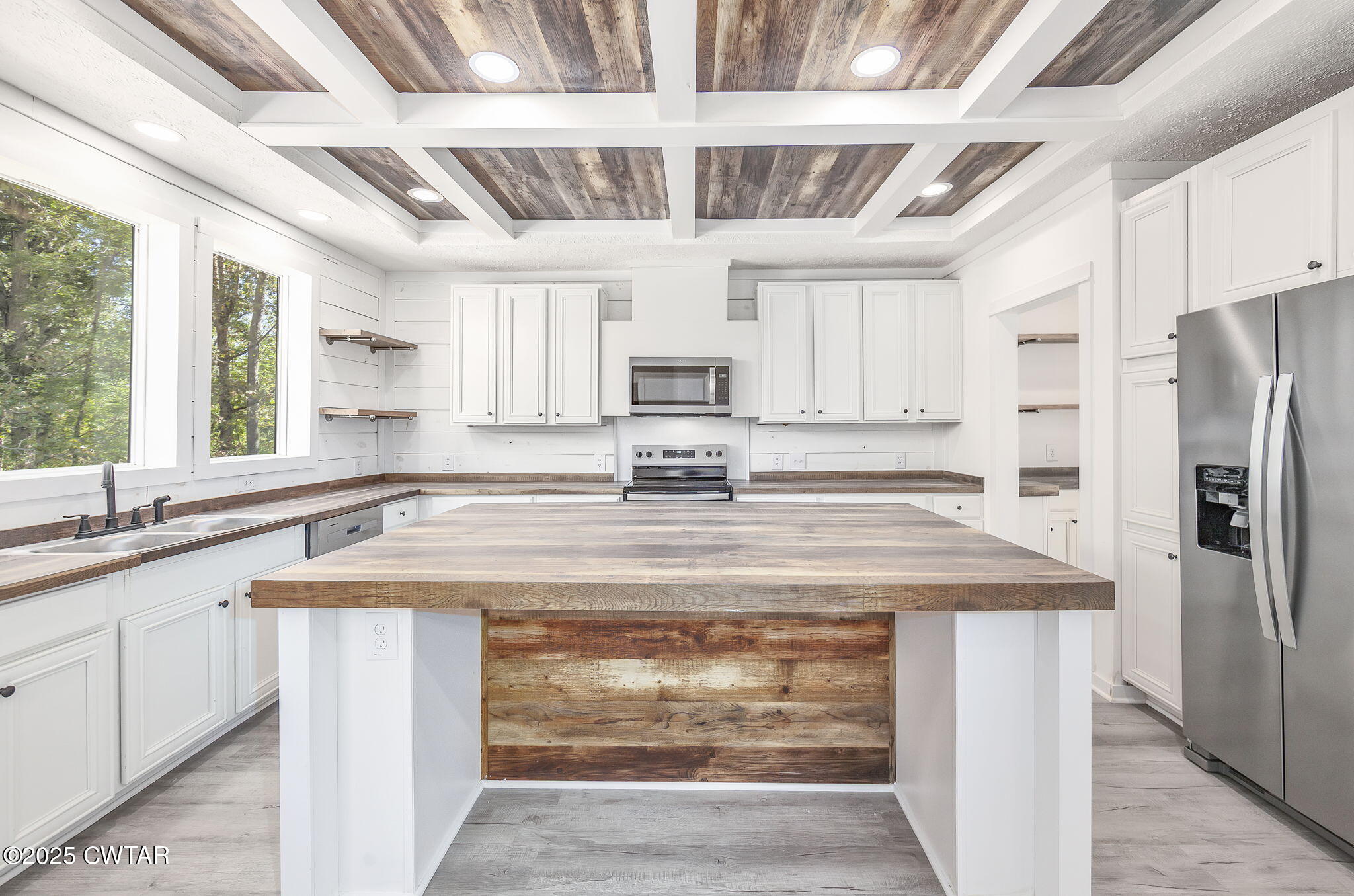 2885 Old Friendship Road Finger, TN 38334 - Photo 7 of 50 a kitchen with stainless steel appliances granite countertop a sink window and refrigerator