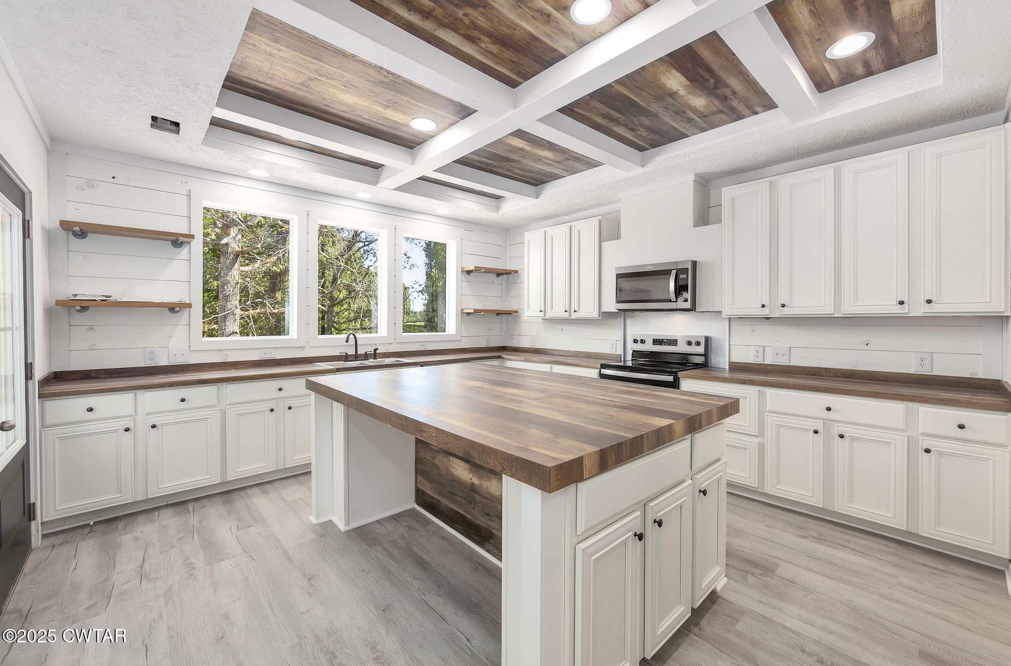 2885 Old Friendship Road Finger, TN 38334 - Photo 8 of 50 a kitchen with granite countertop a sink appliances cabinets and a counter top space