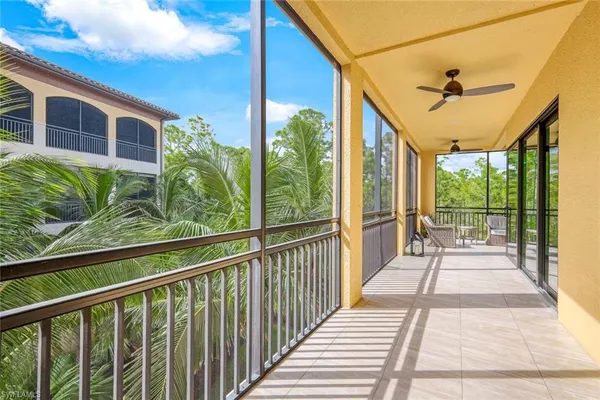 a view of a balcony with wooden floor