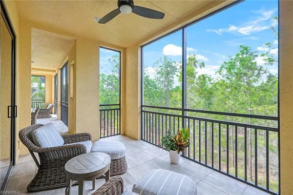 a view of a livingroom with furniture wooden floor and a window