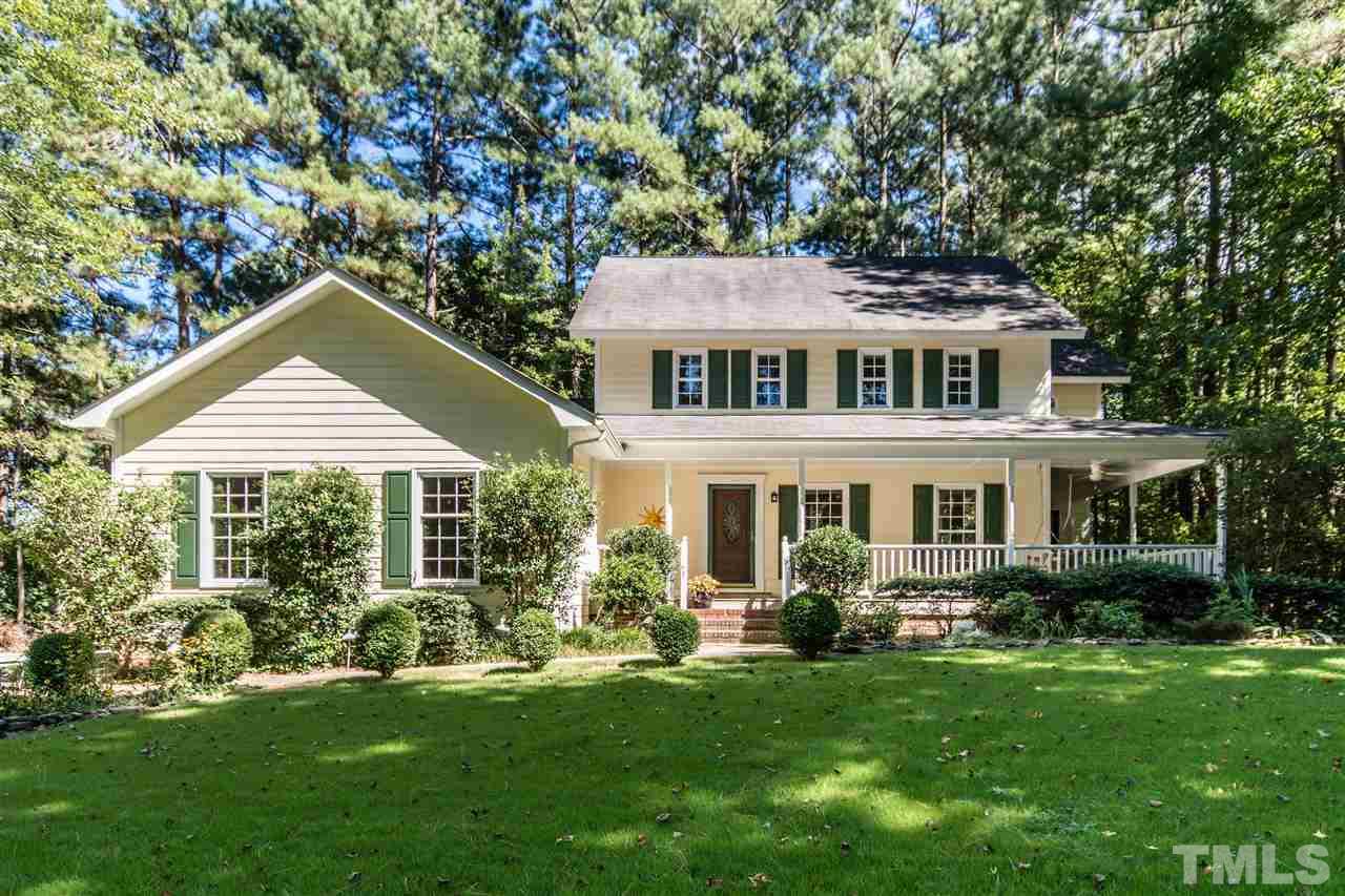 5606 Red Coach Road Durham, NC 27712 - Photo 1 of 25 a front view of a house with a garden